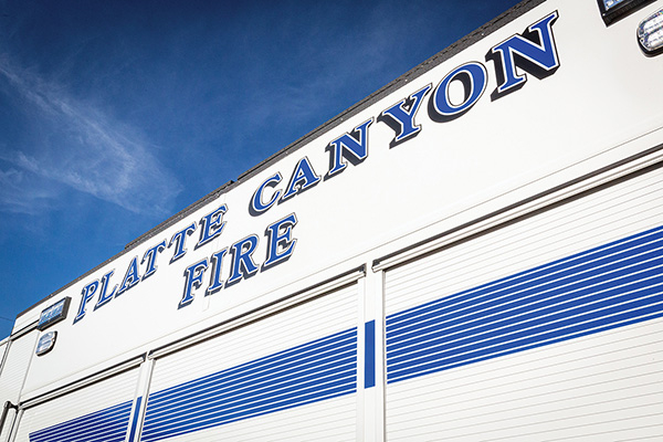 Side of pumper fire truck displaying Platte Canyon Fire Department name