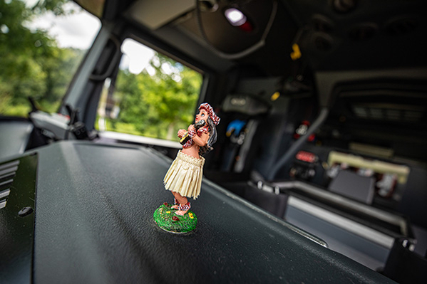 Hula girl bobble head on interior dash of aerial ladder fire truck
