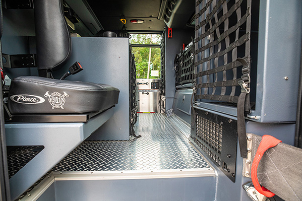Interior crew cab with diamond plated flooring of fire truck
