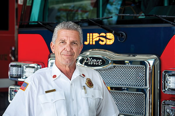 Fire Chief in front of Pierce Fire Truck