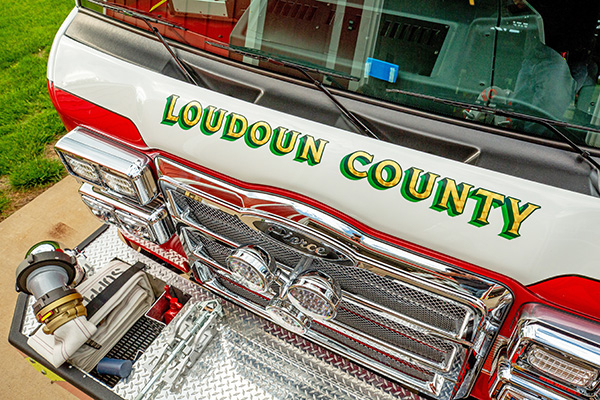 Front grille of fire truck with Pierce logo and rotoray