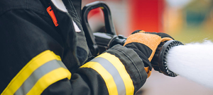 Firefighter spraying foam from Pierce foam system