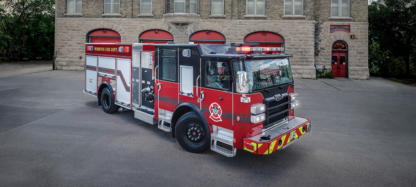Pierce Pumper Fire Truck parked in front of building in Winnipeg Canada equipped with Idle Reduction Green Technology