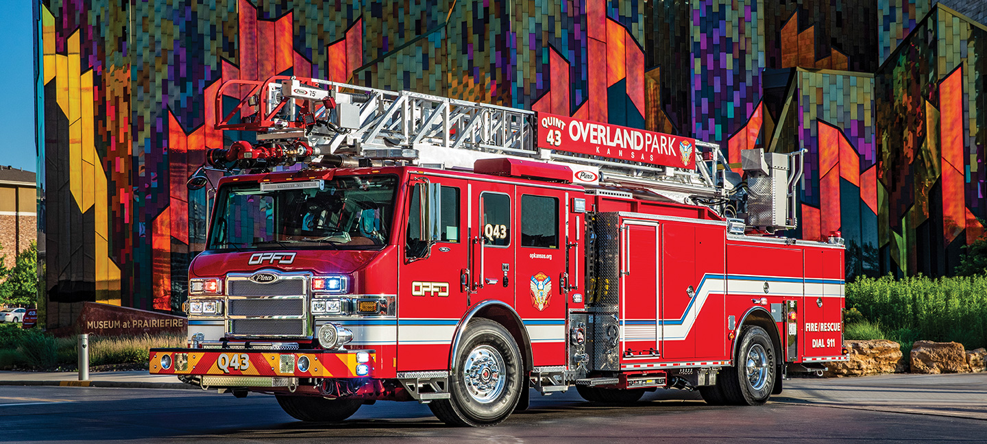 Ladder Fire Truck Parked in front of painted monument in Overland Park Kansas